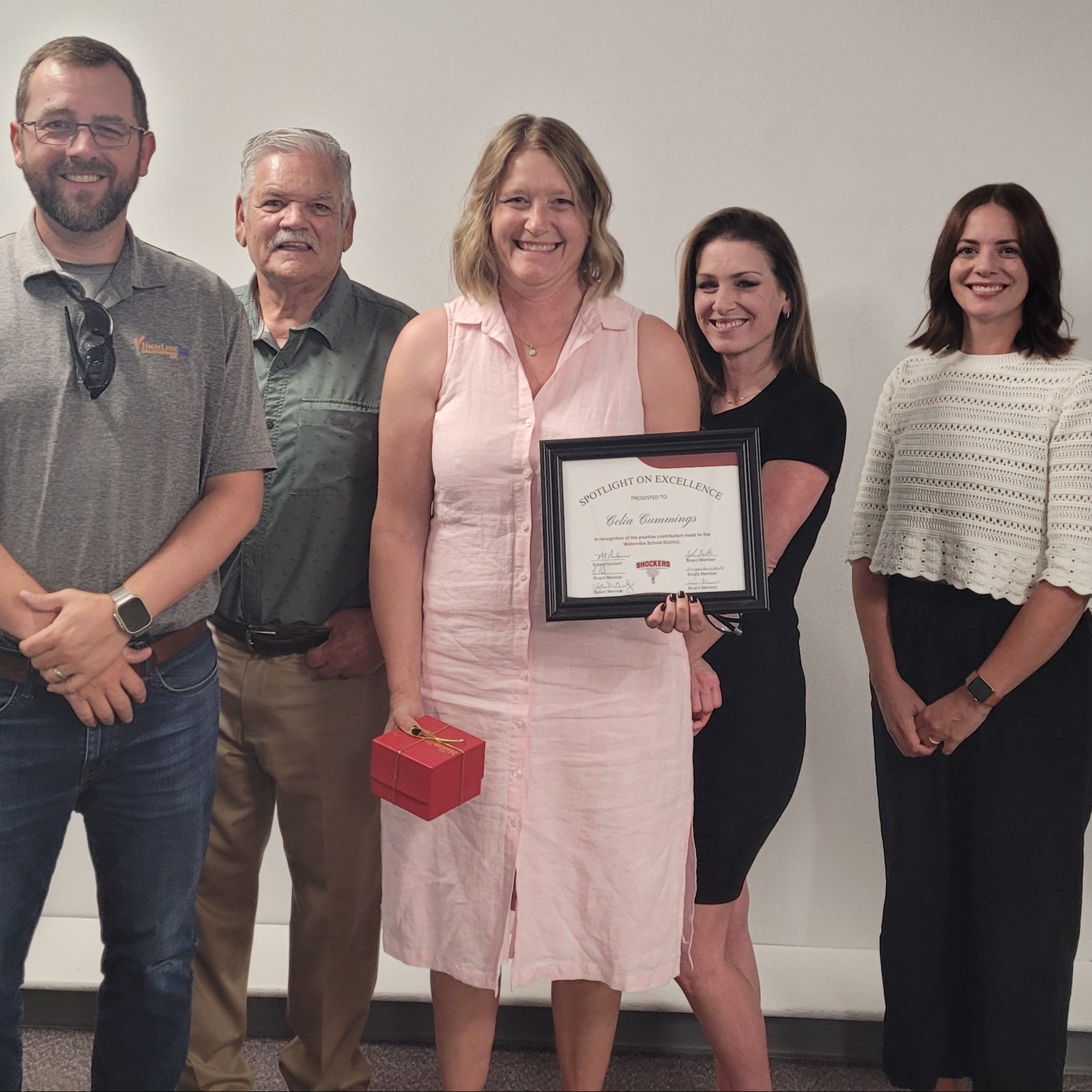 Women received an award from the school board.