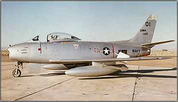 A fighter jet on the tarmac beside a sign reading "Air Force."