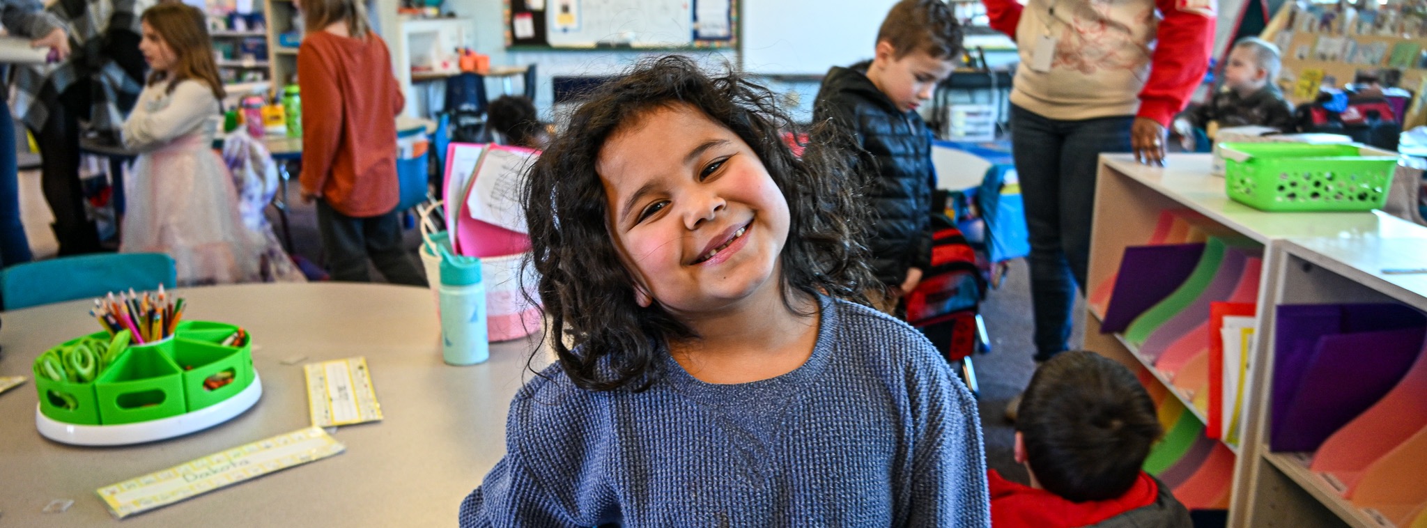 Kindergarten kid smiling in classroom