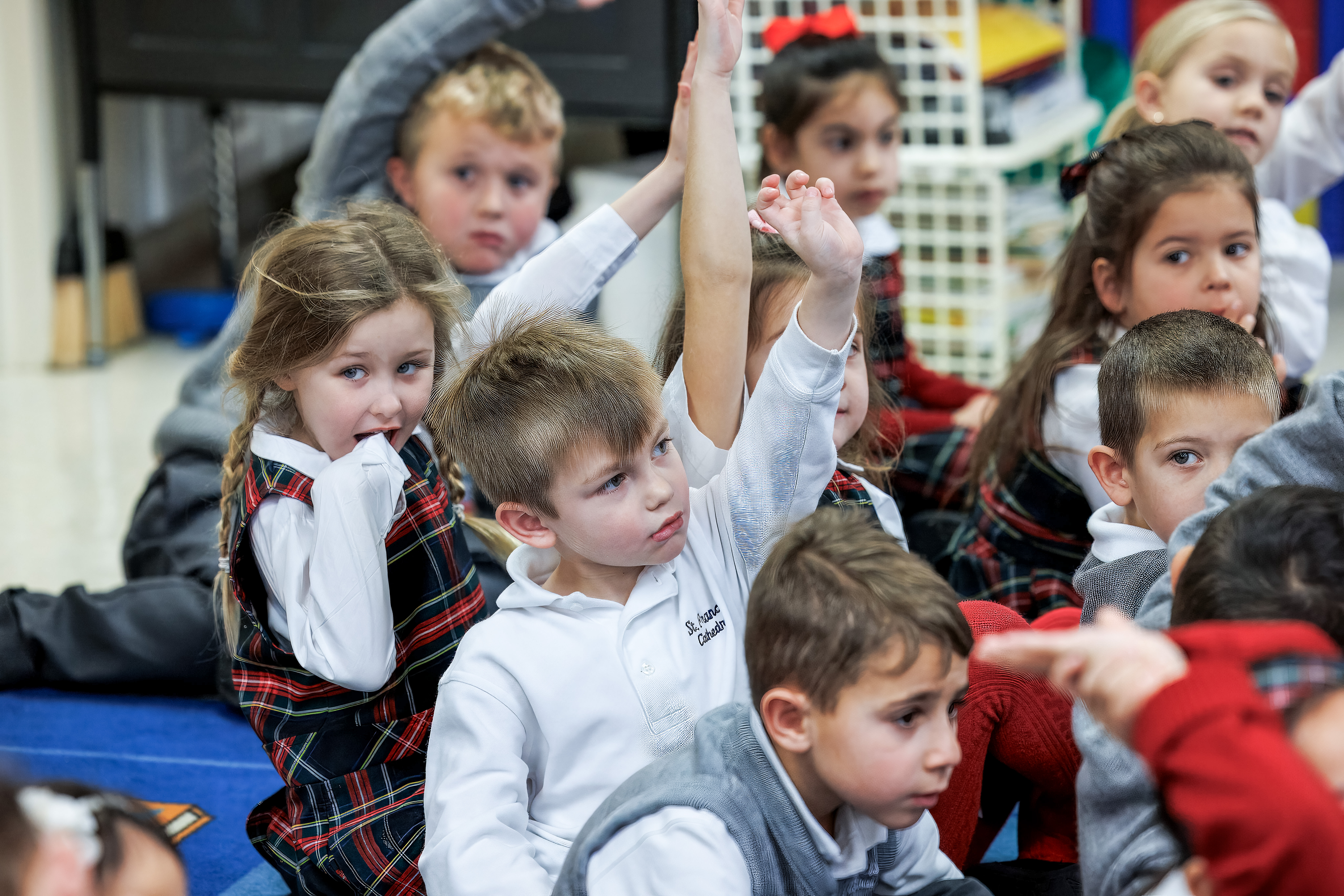 kids raising hands
