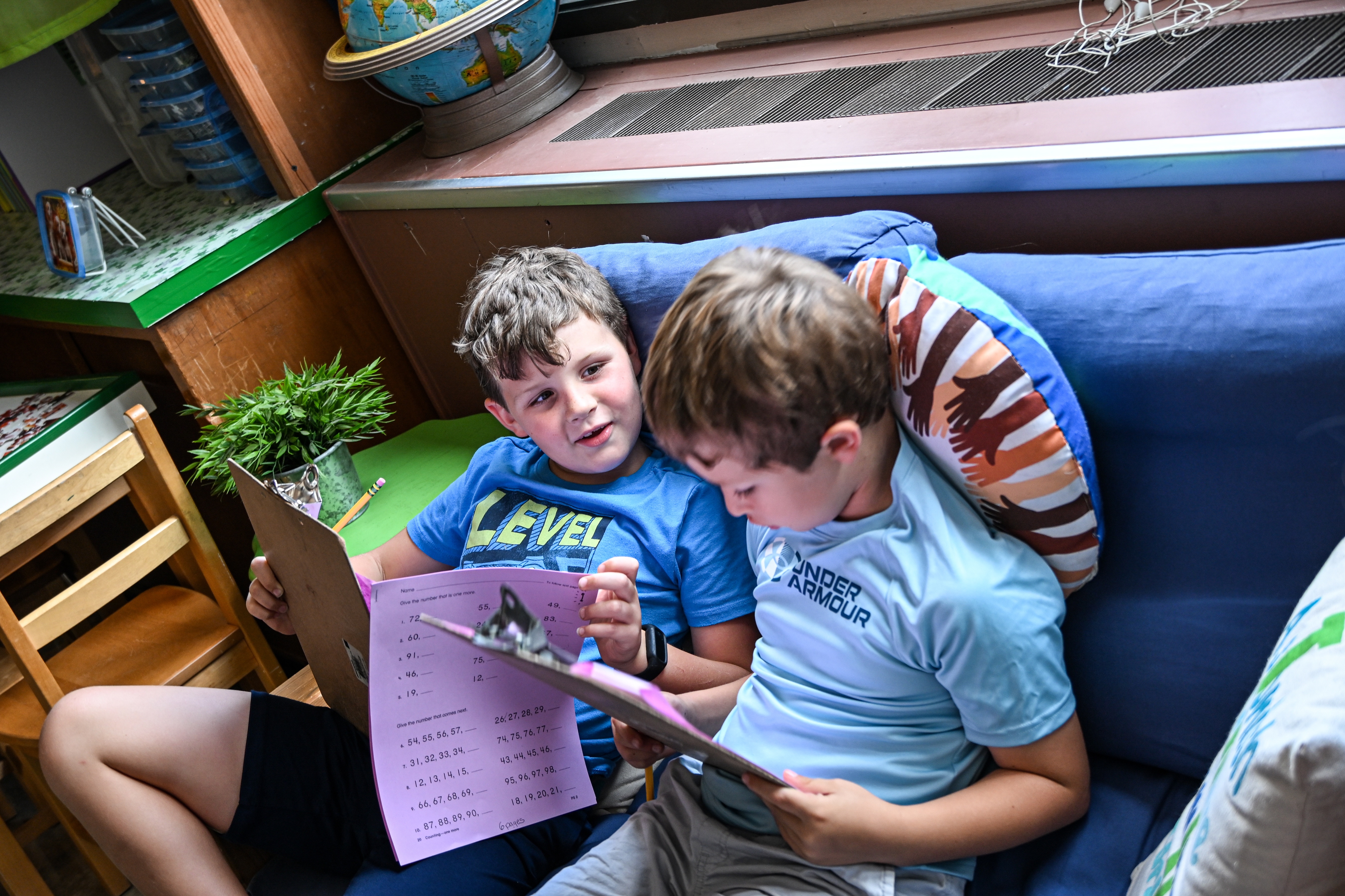 Two students working on school work
