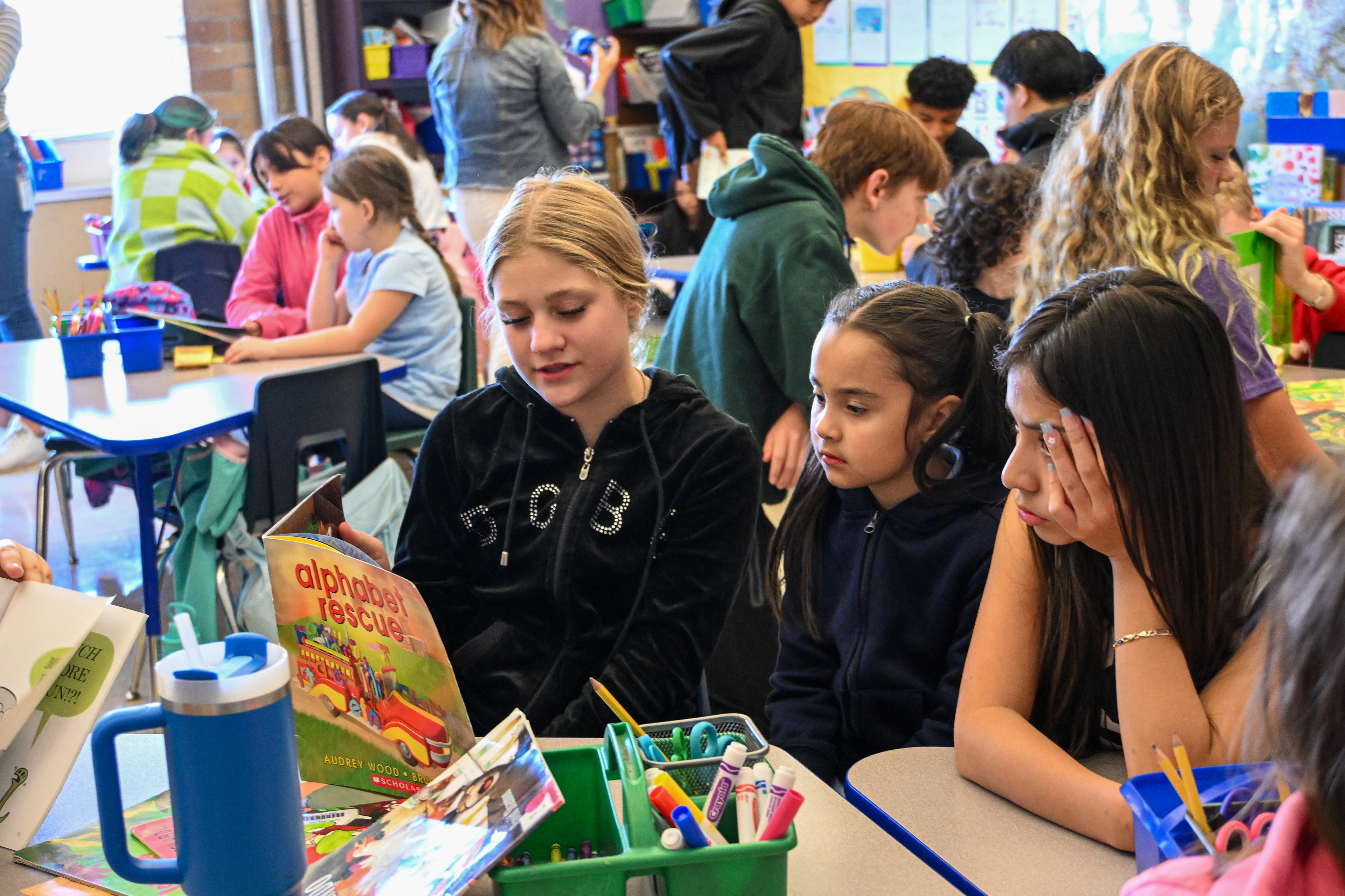 Older students reading to younger students