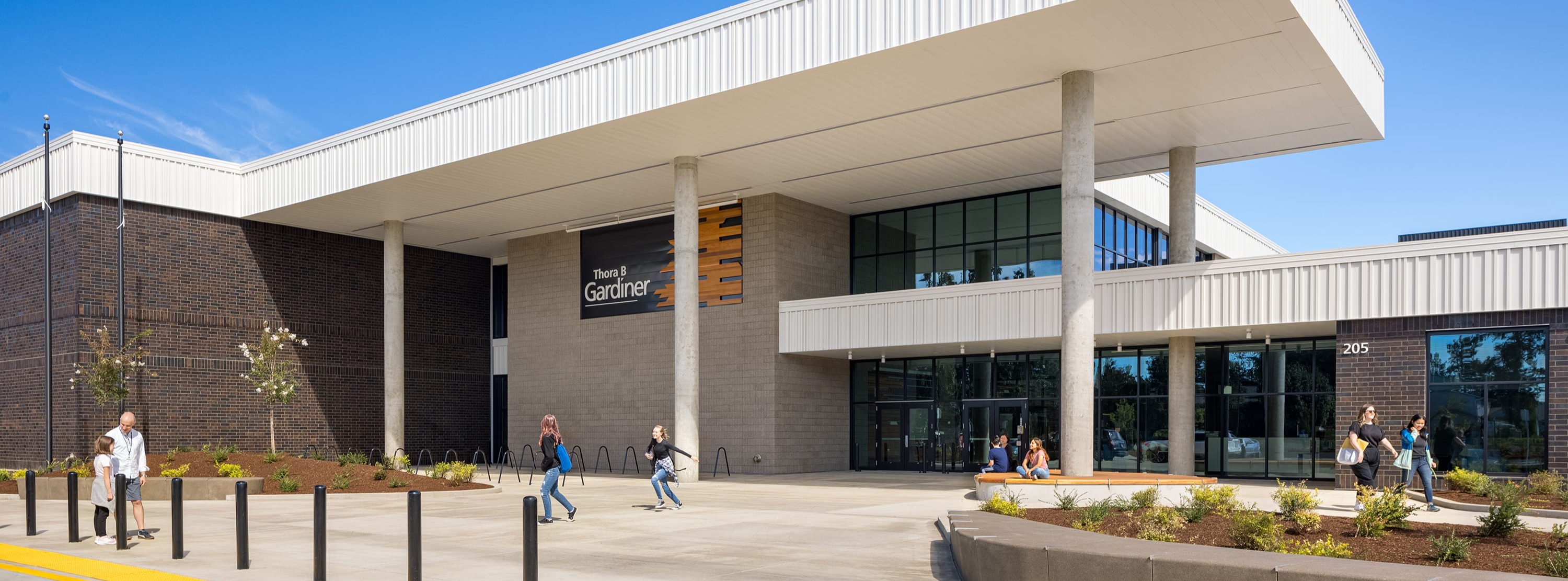 exterior front entrance of Gardiner with large rain cover and tall windows
