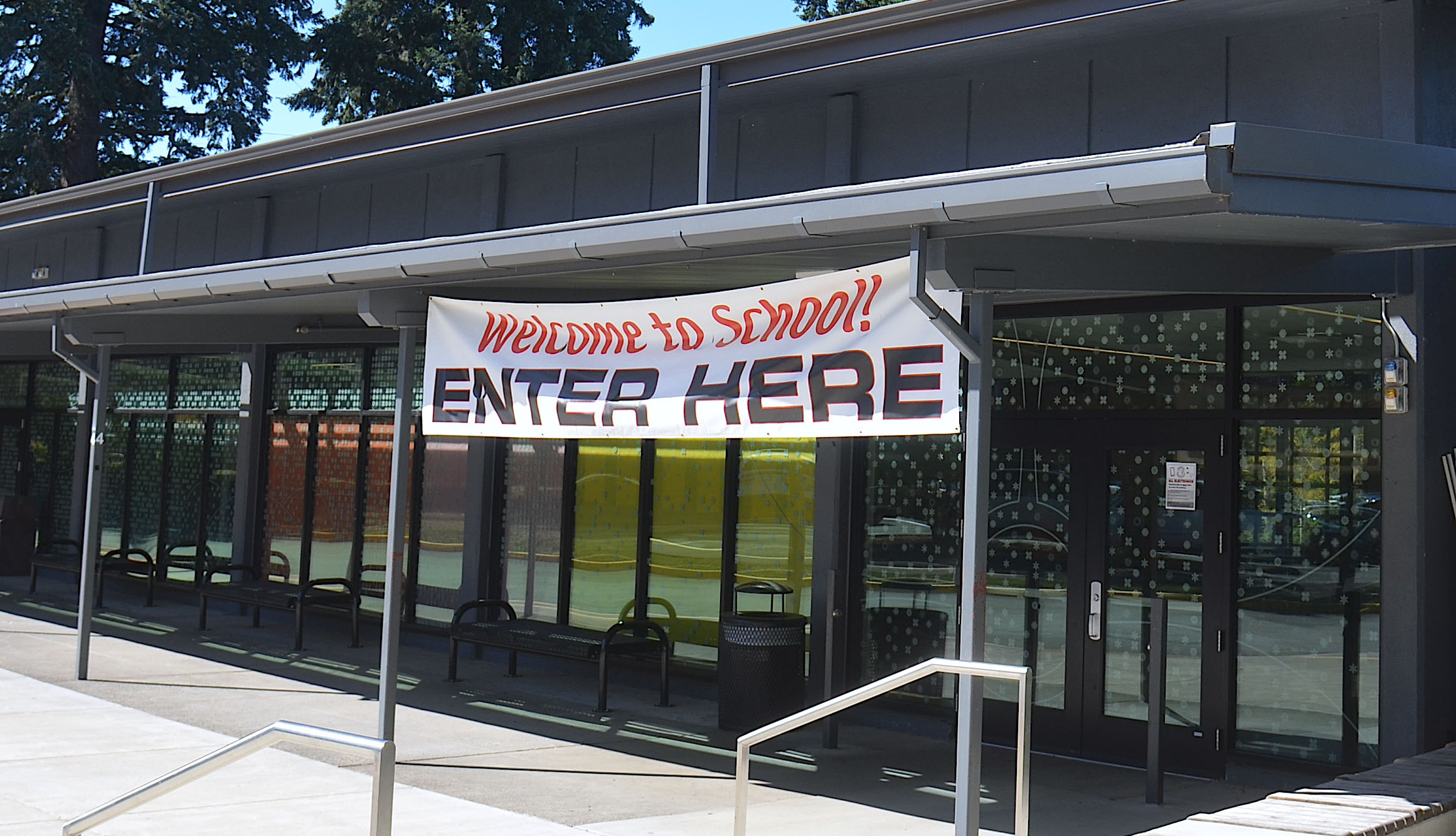 Students welcome sign above the entry doors of tumwata
