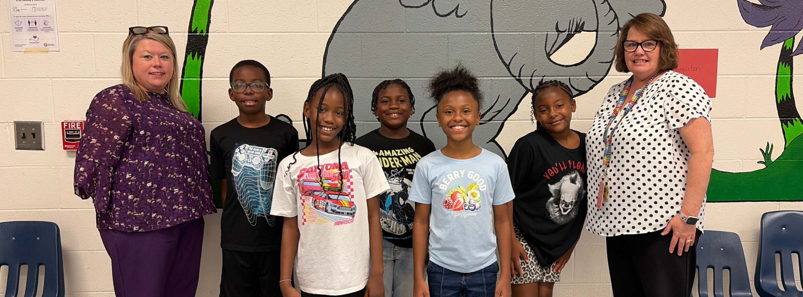 Elizabethtown Primary students stand smiling with principal and media coordinator.