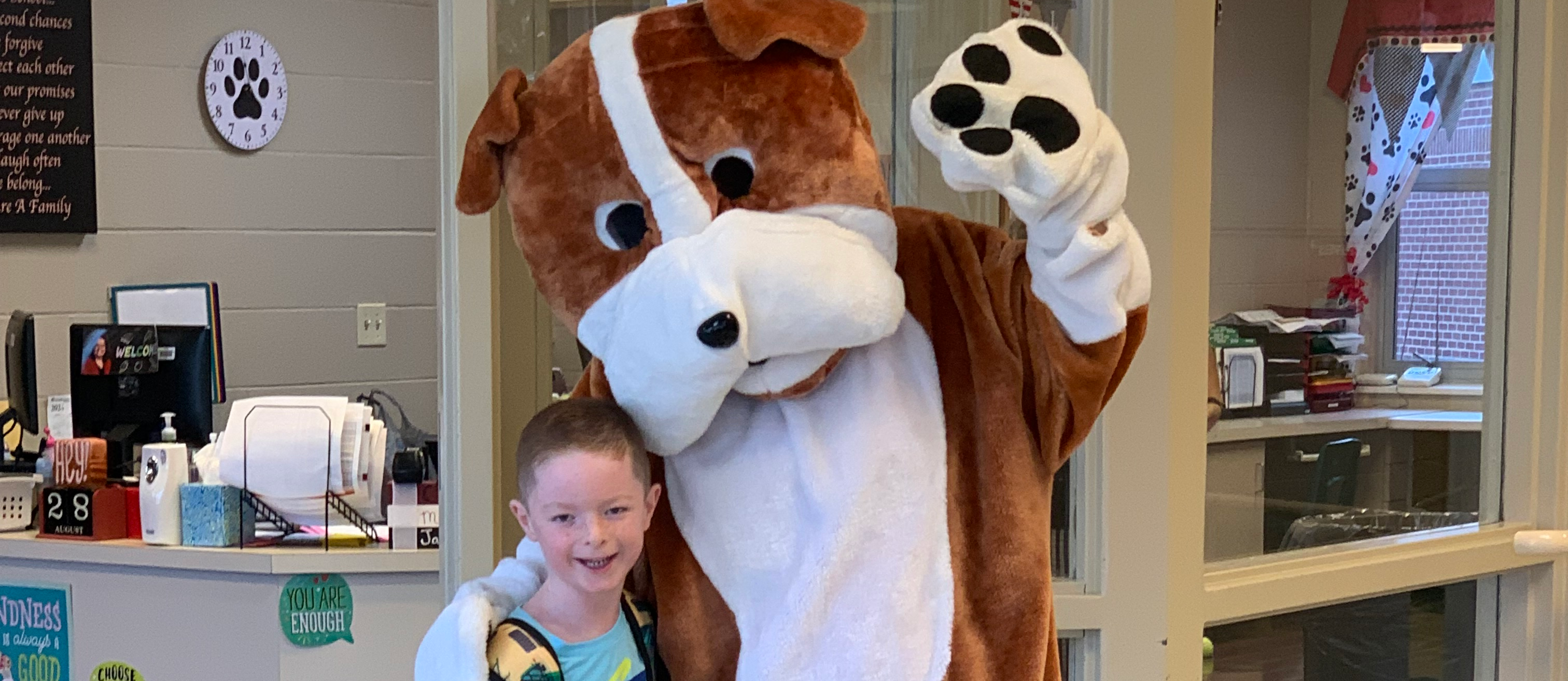 Student posing with Bulldog Mascot