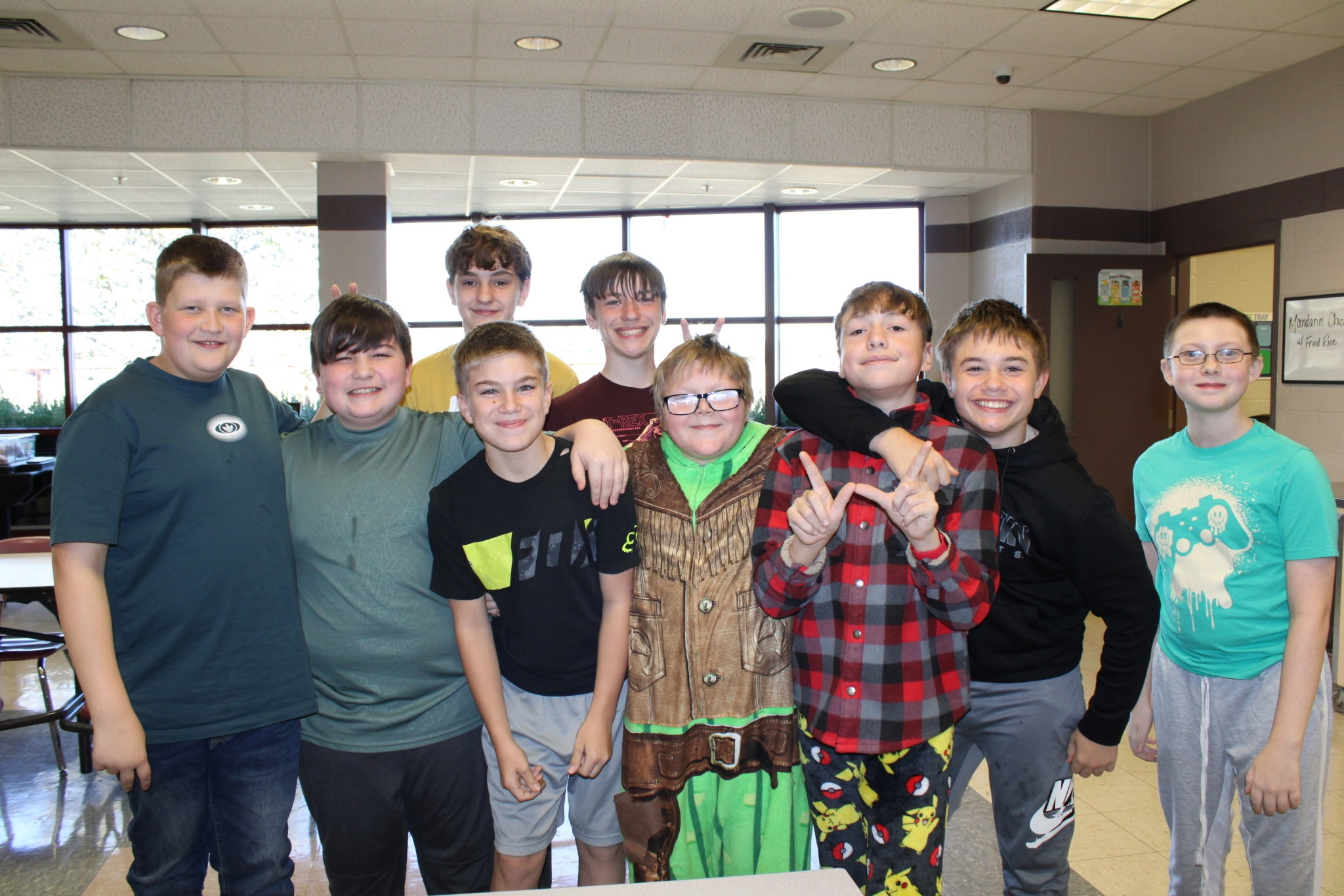 Group of Students posing for a picture in the cafeteria