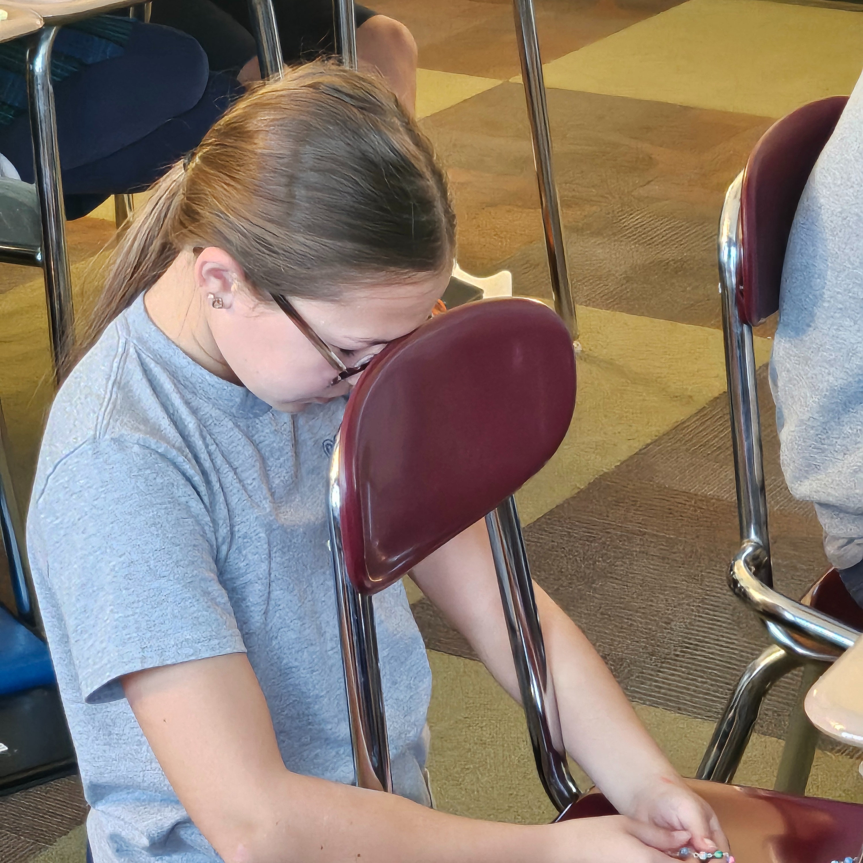 STUDENT PRAYING