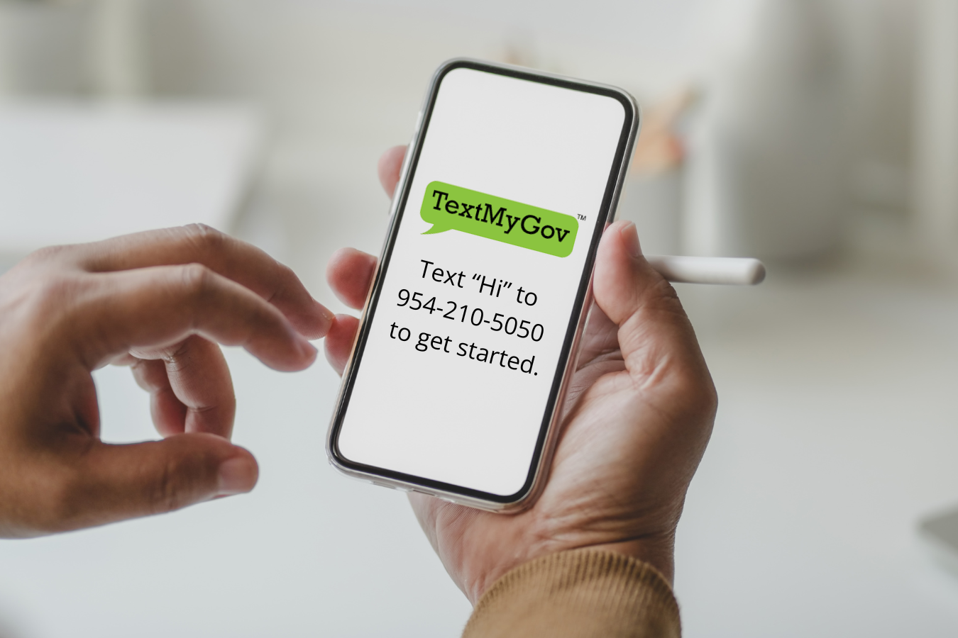 Phone with TextMyGov logo