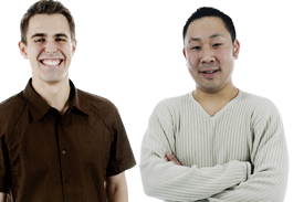 Two men standing beside each other smiling