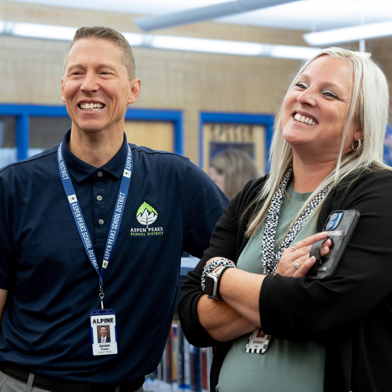 board member visits with a principal