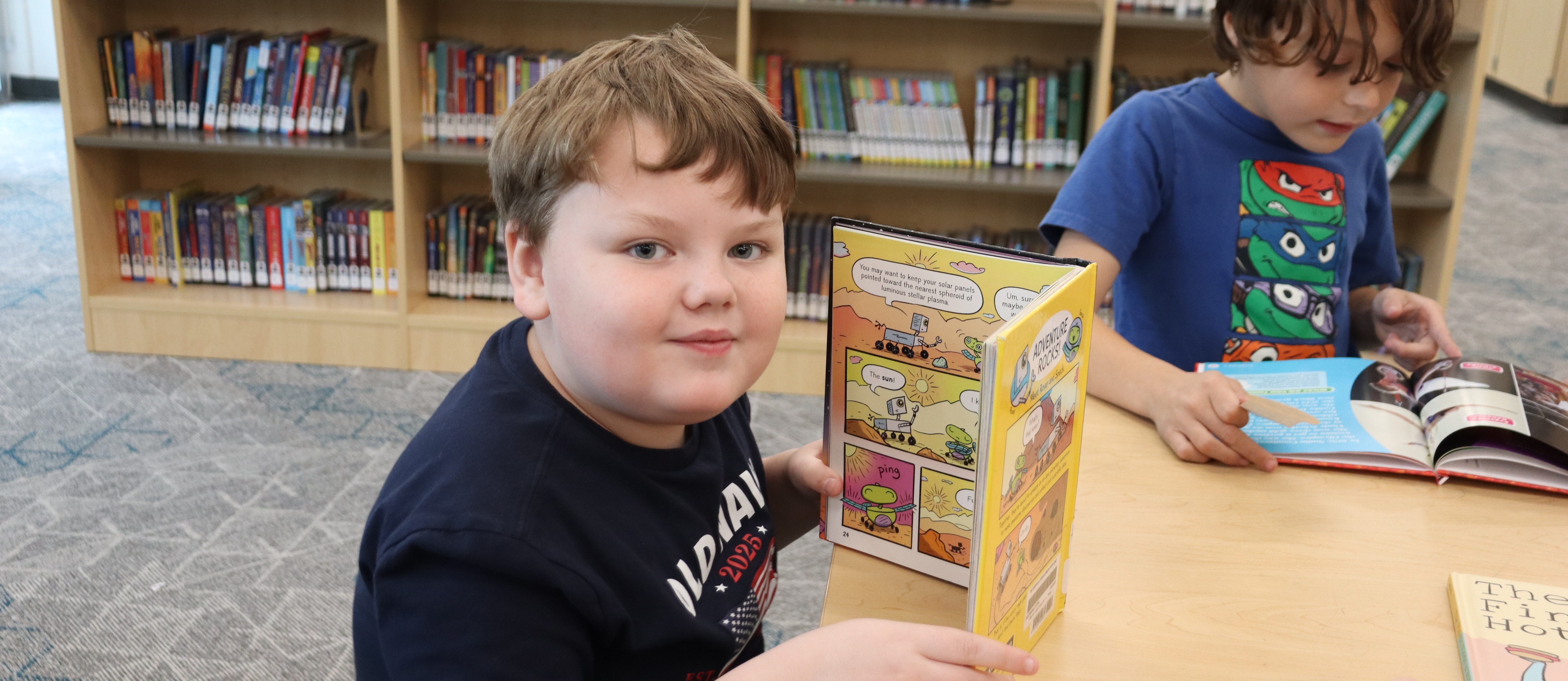 two boys reading books