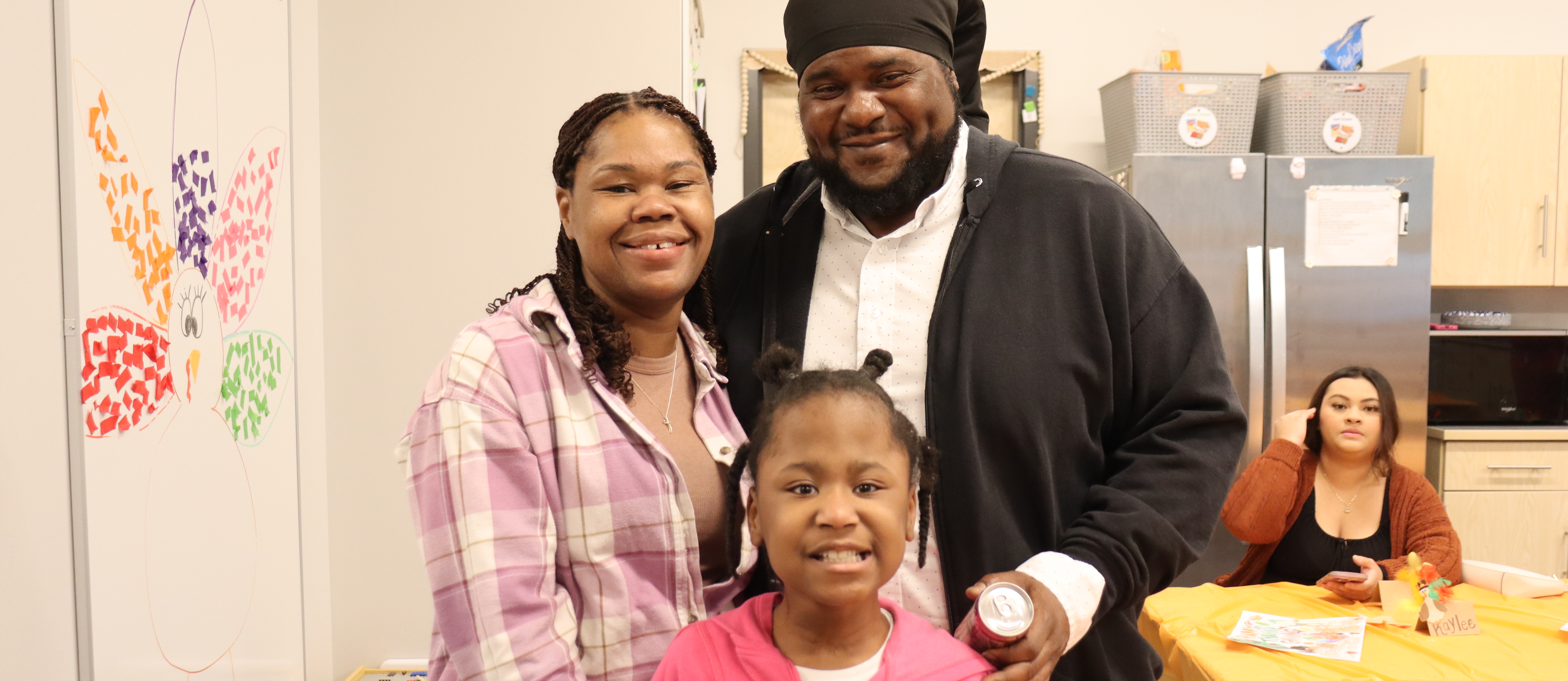 mom and dad with daughter