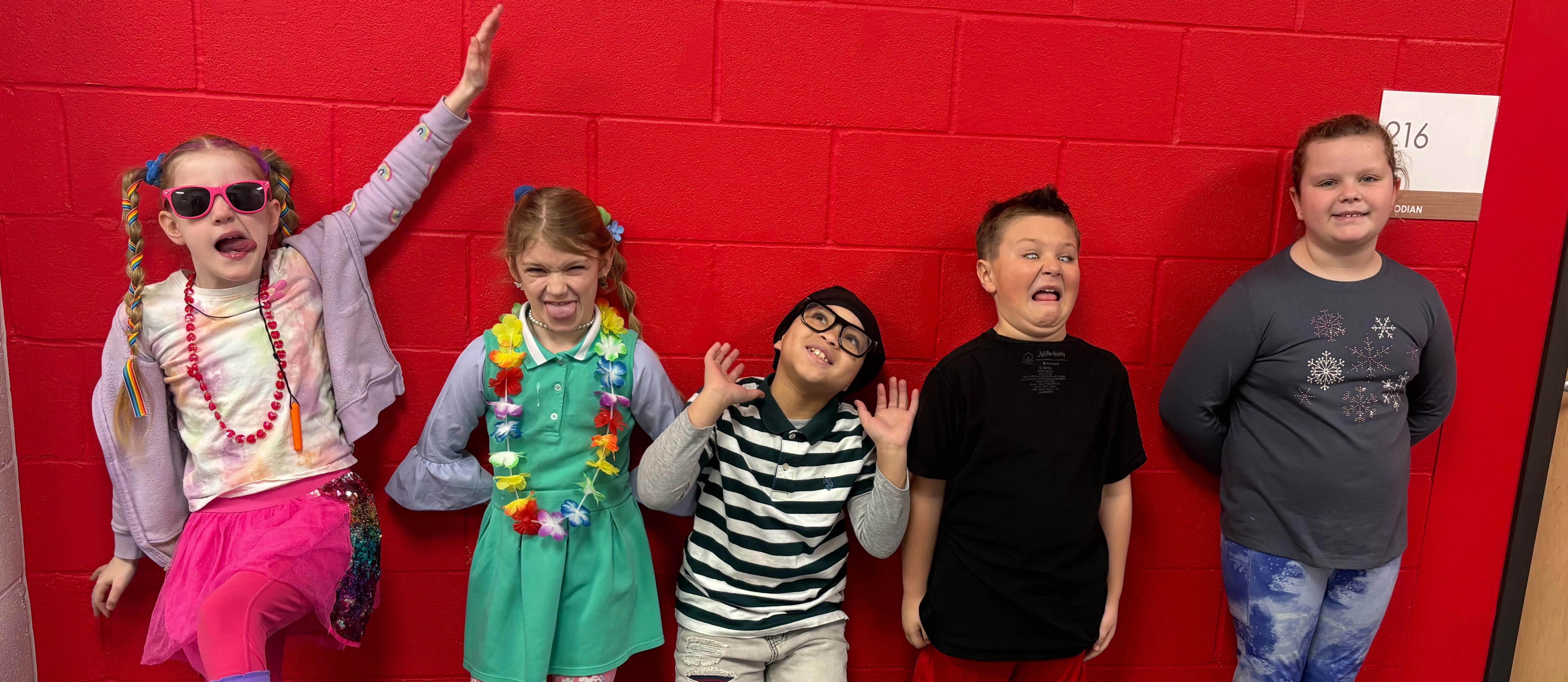 five kids wearing wacky closes and  doing wacky poses for Wacky Wednesday