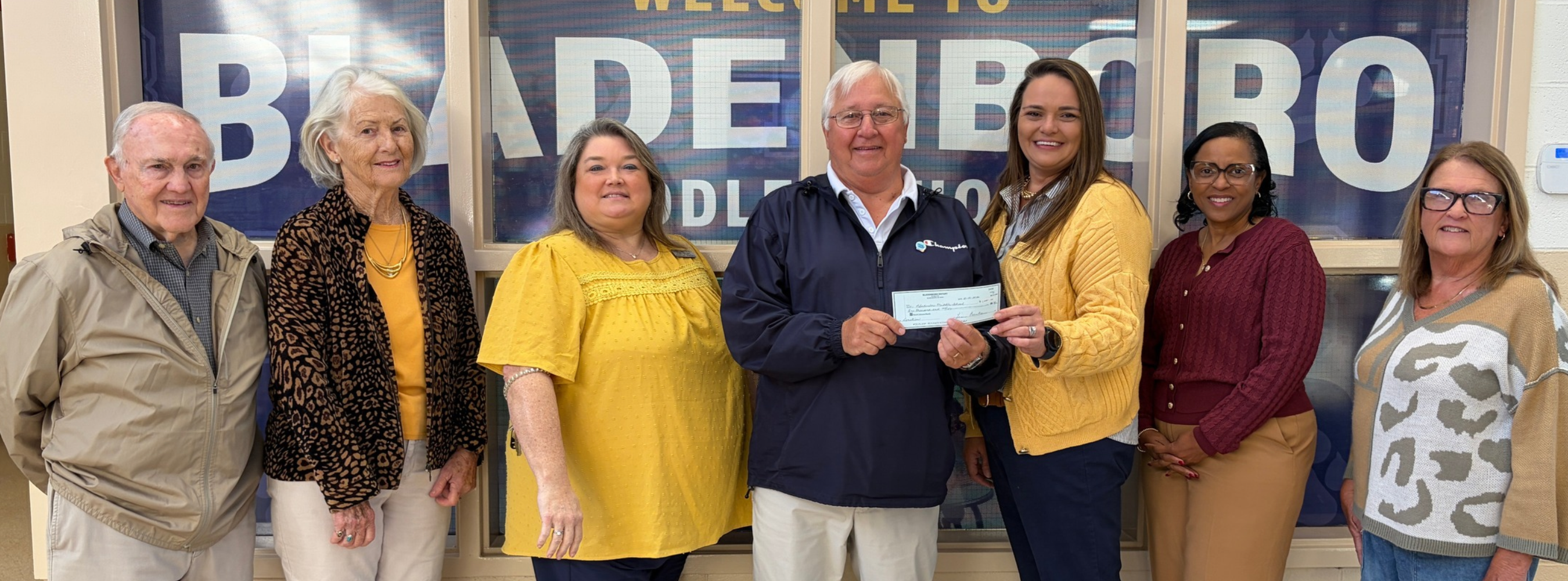 Bladenboro Rotary members present a check to BMS .