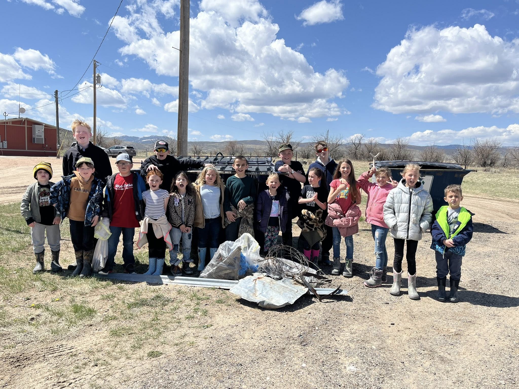 students standing in front of rural school