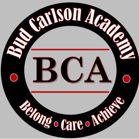 Black circular logo with white text on a gray background. The words "Bud Carlson Academy" are in red, and "BCA" is in black.