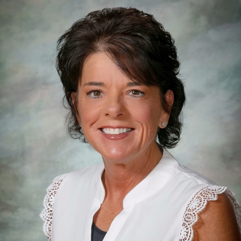 Mrs. Grimes smiling at the camera