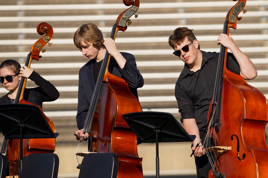 group of students playing basses
