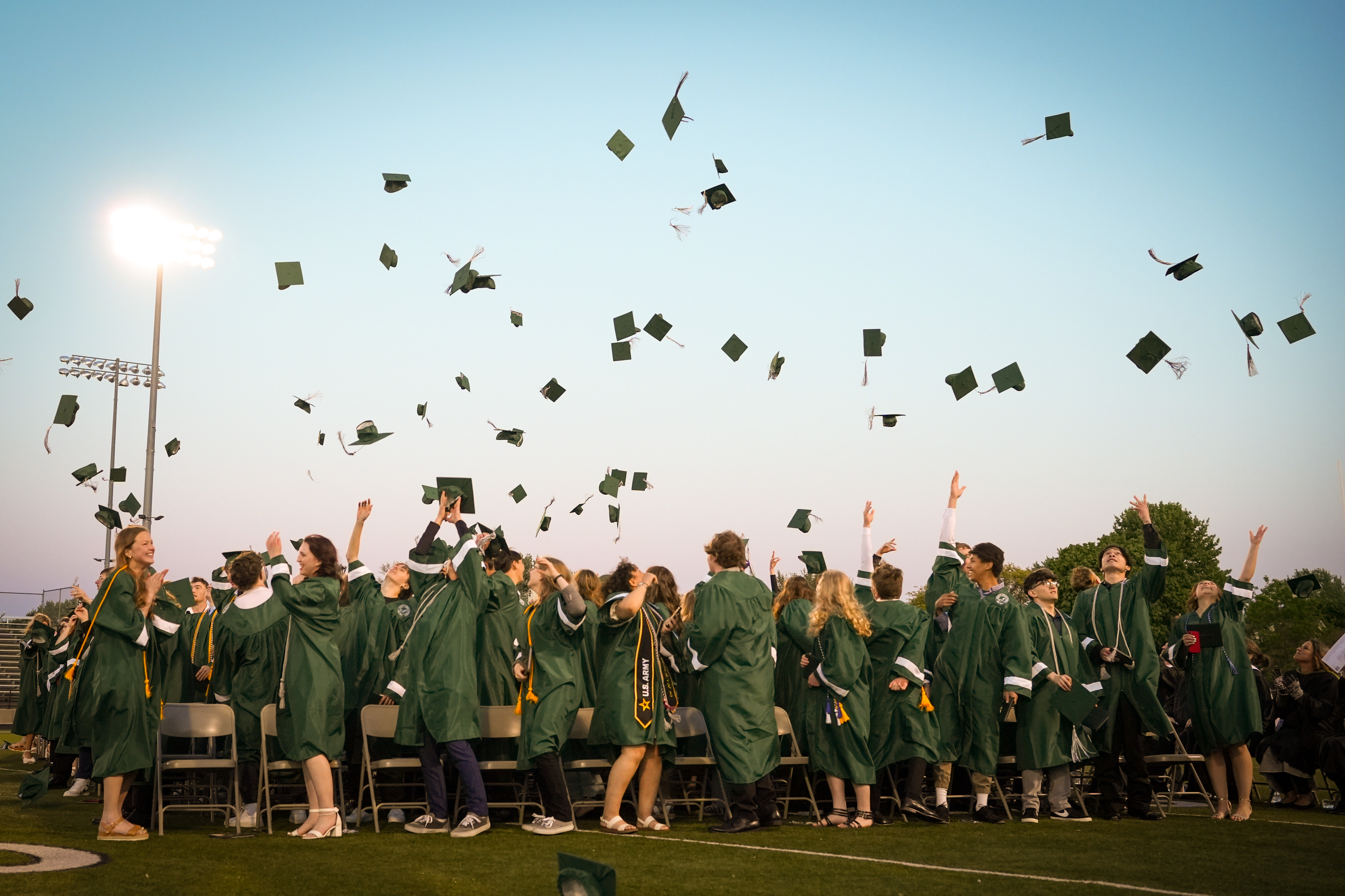 Graduates throwing their caps in the air