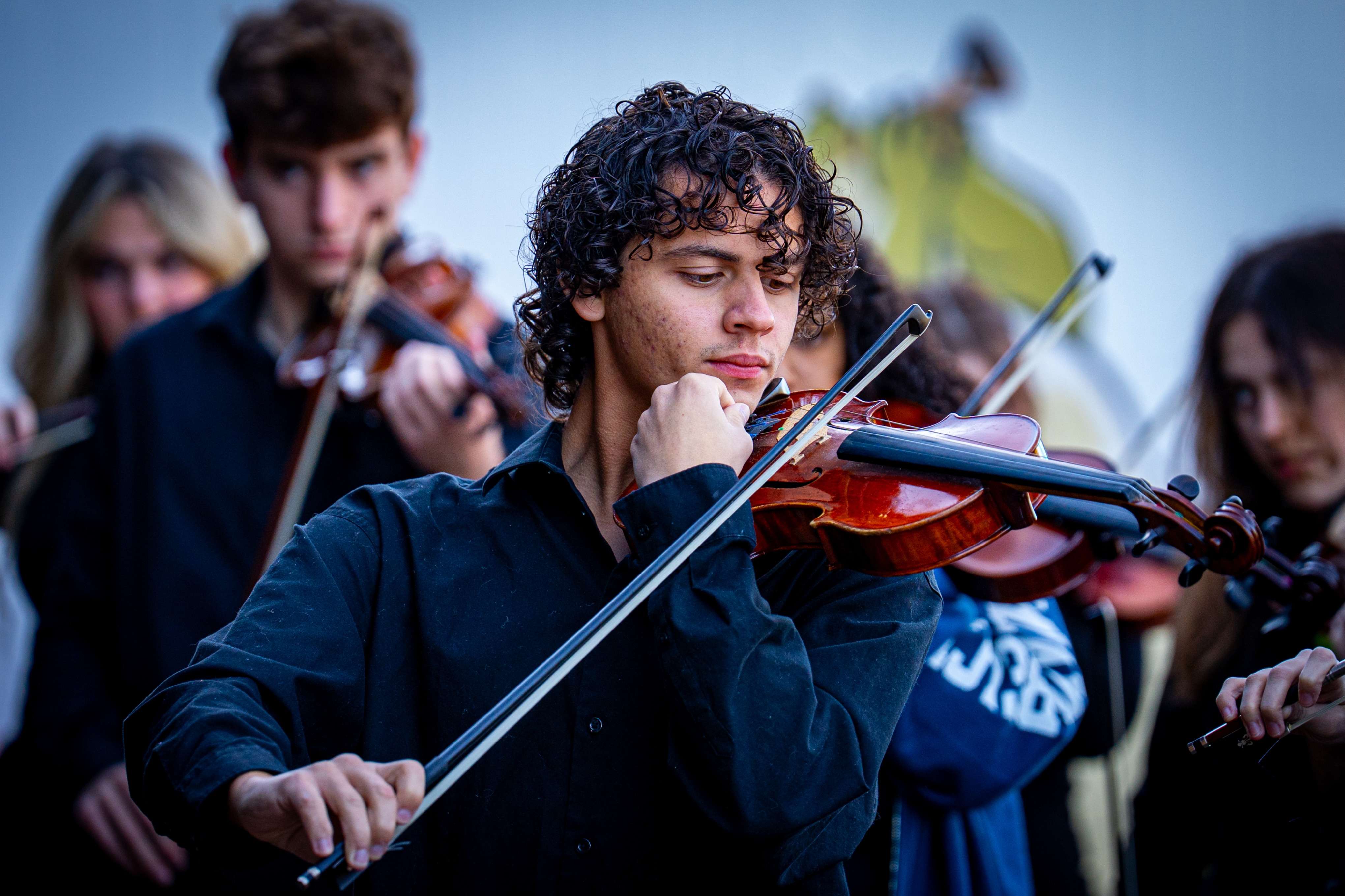 Student playing in orchestra at Disney