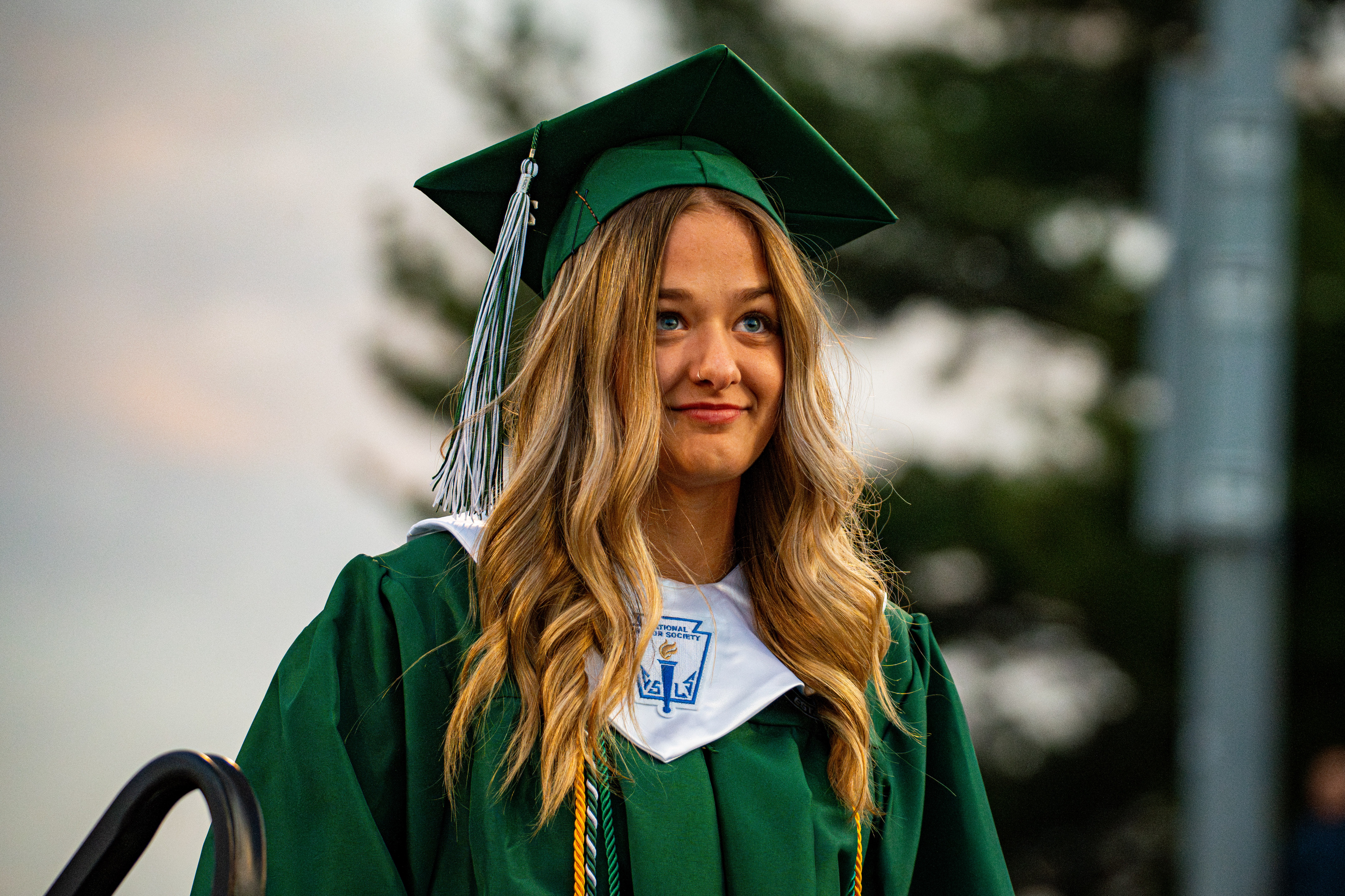 Female graduate smiling before the stage