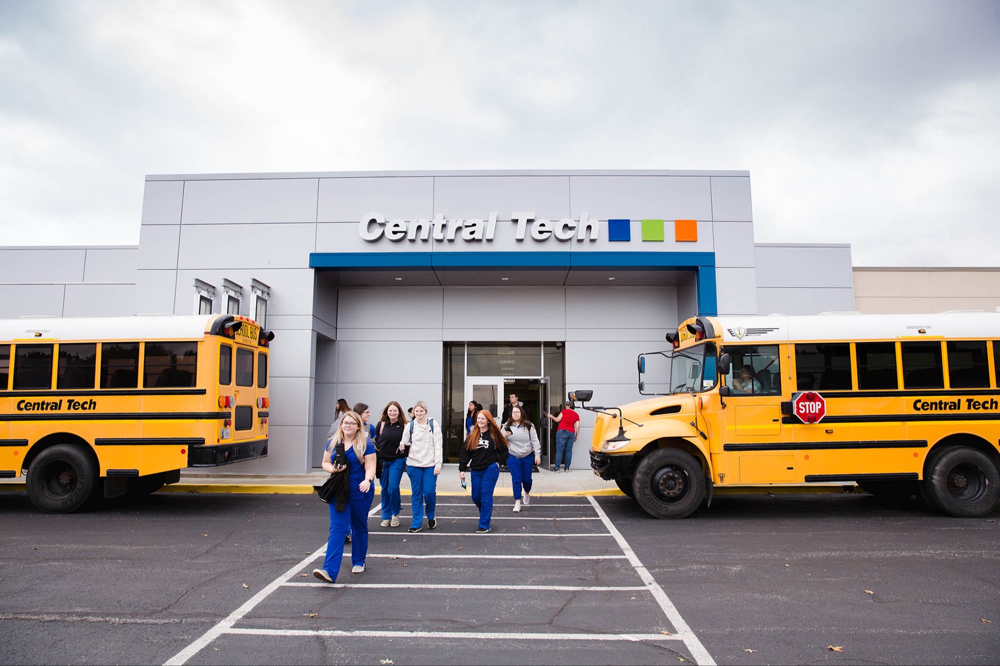 students leaving the Central Tech Sapulpa campus with buses on each side