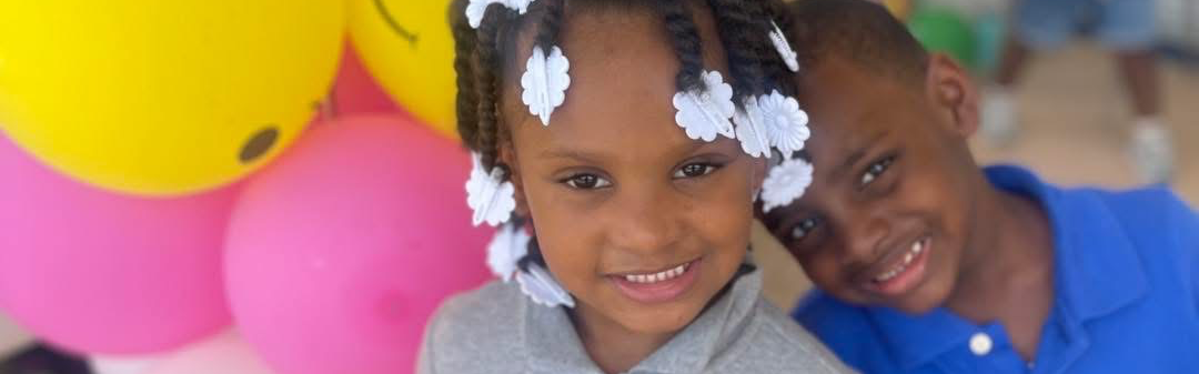 Students outside with balloons