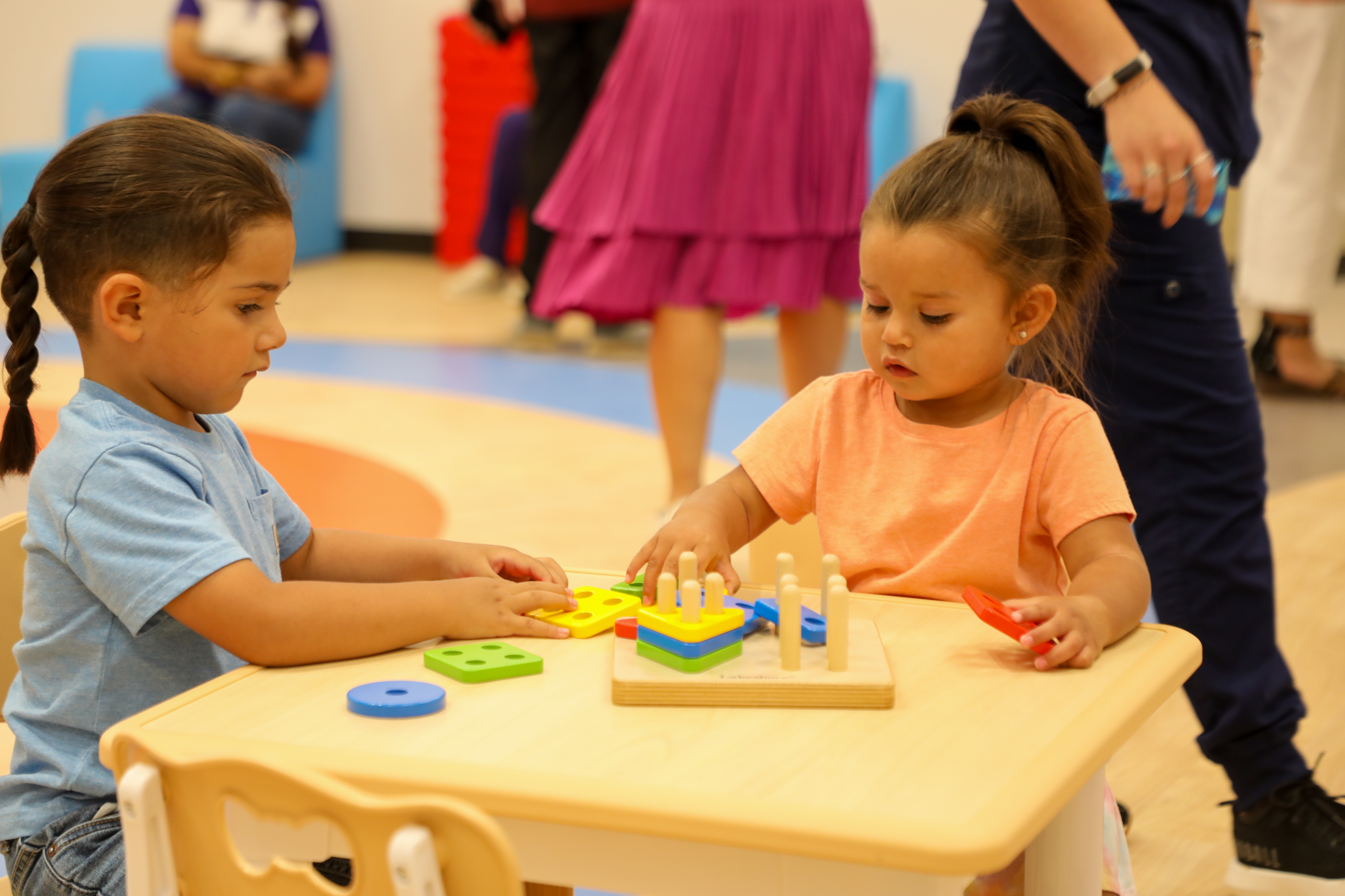 students playing with puzzle