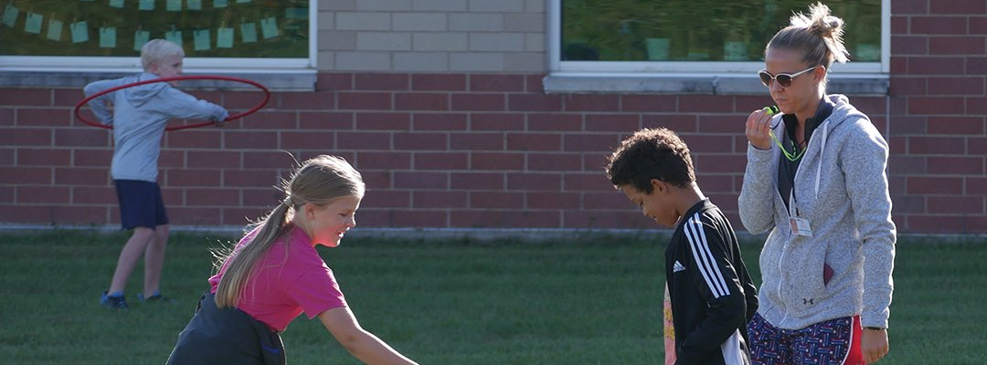GES students playing golf in P.E. class