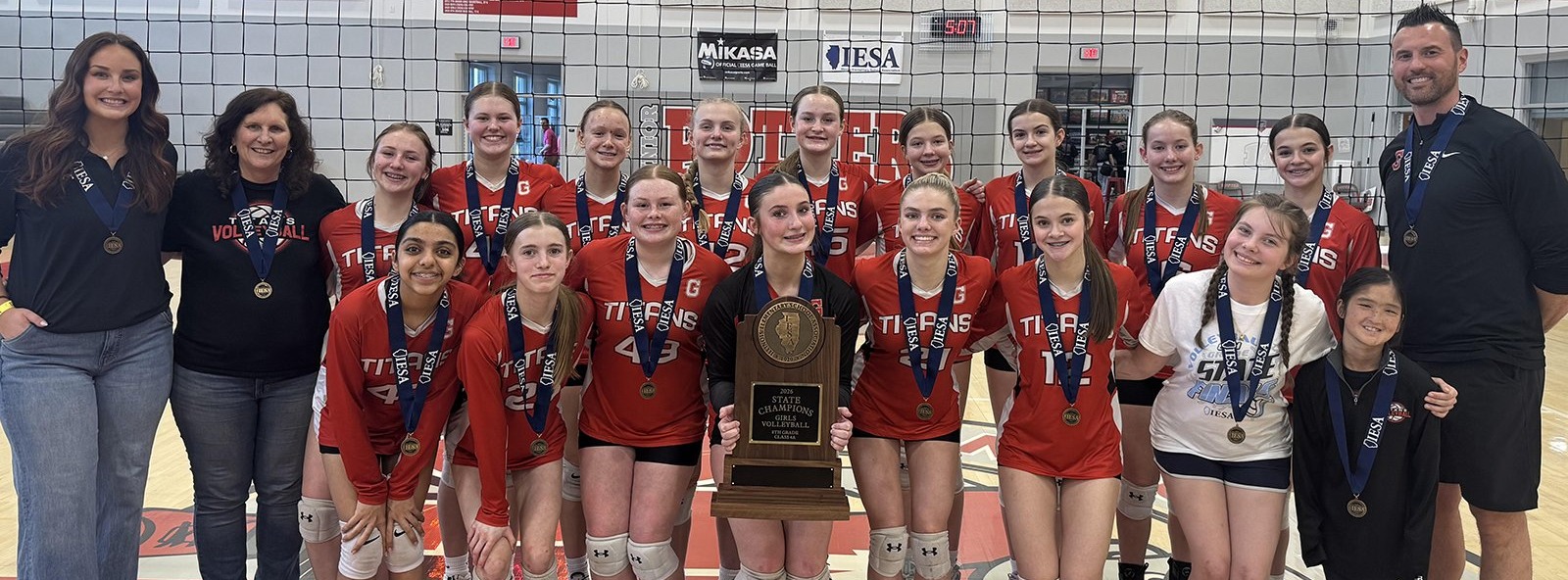 GMS volleyball poses with the state trophy