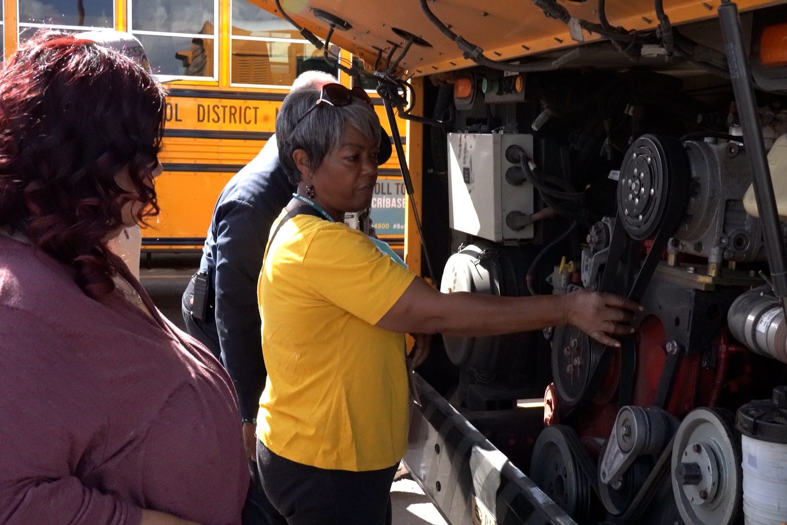 Bus drivers review engine functions during training