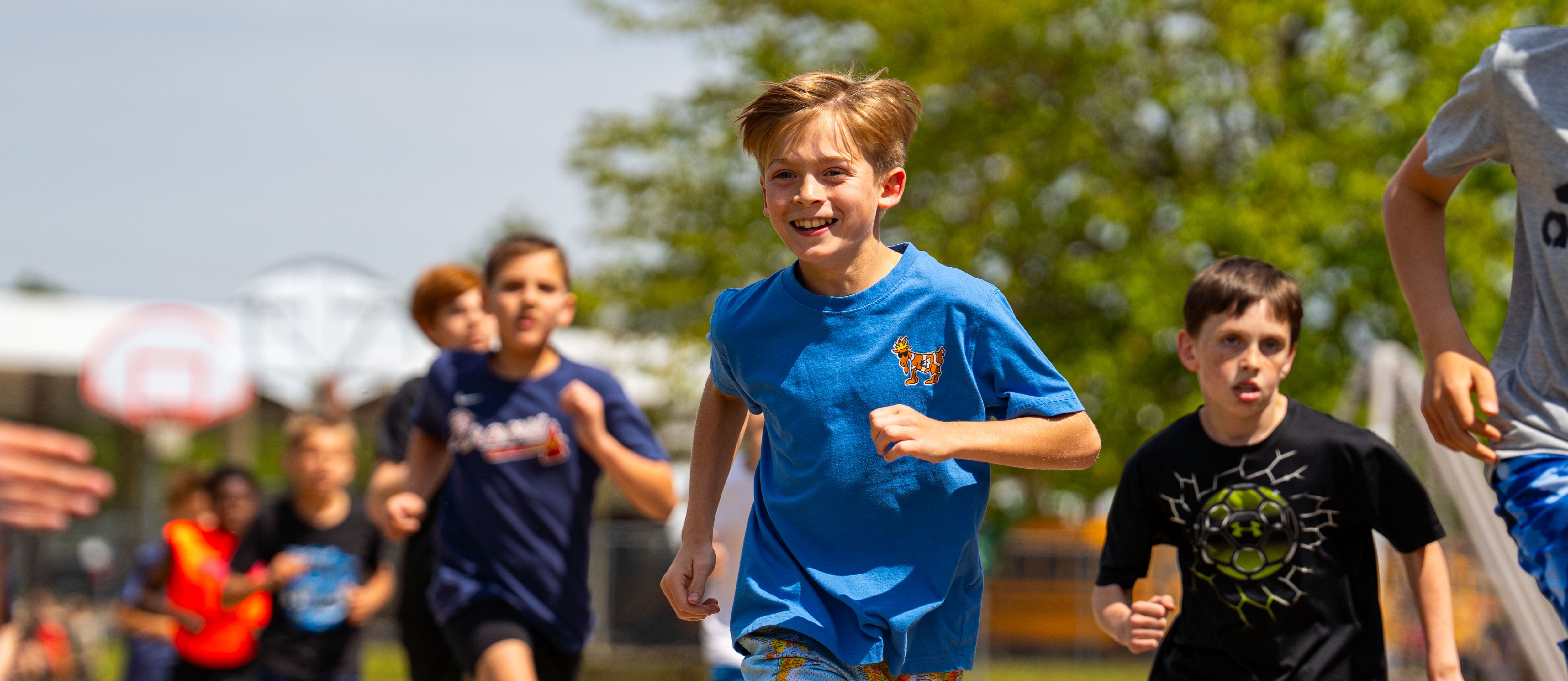 Student smiling while running