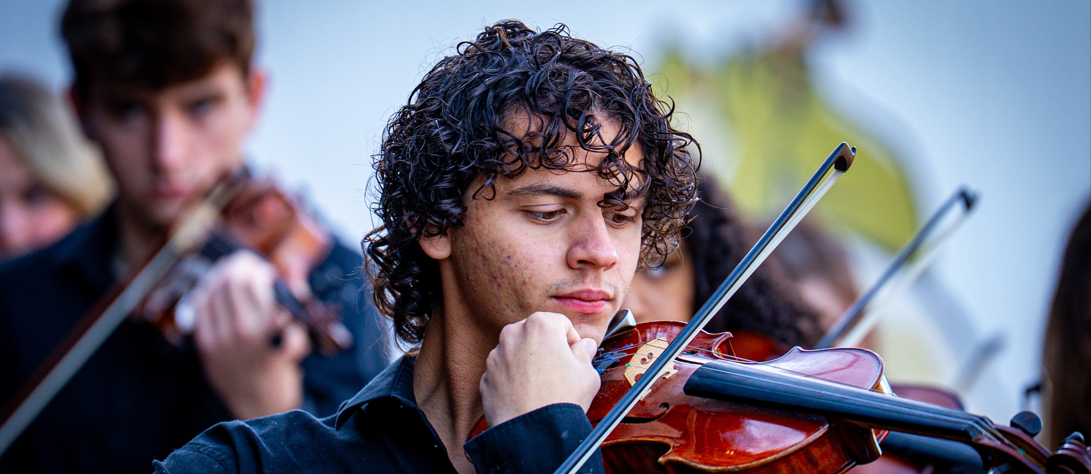 Student in orchestra practicing at Disney
