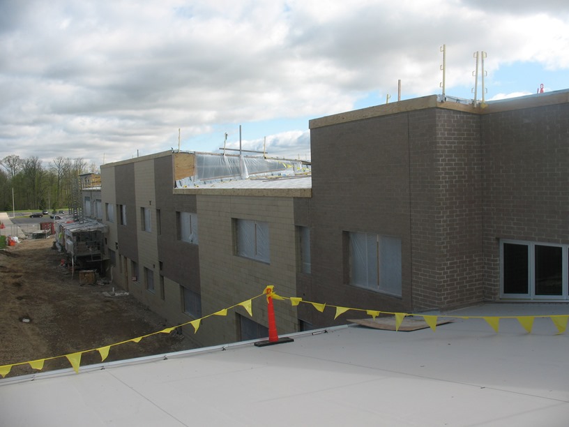 Photo of the view from the roof over the media center looking north at the courtyard that will be between the new building and old building.