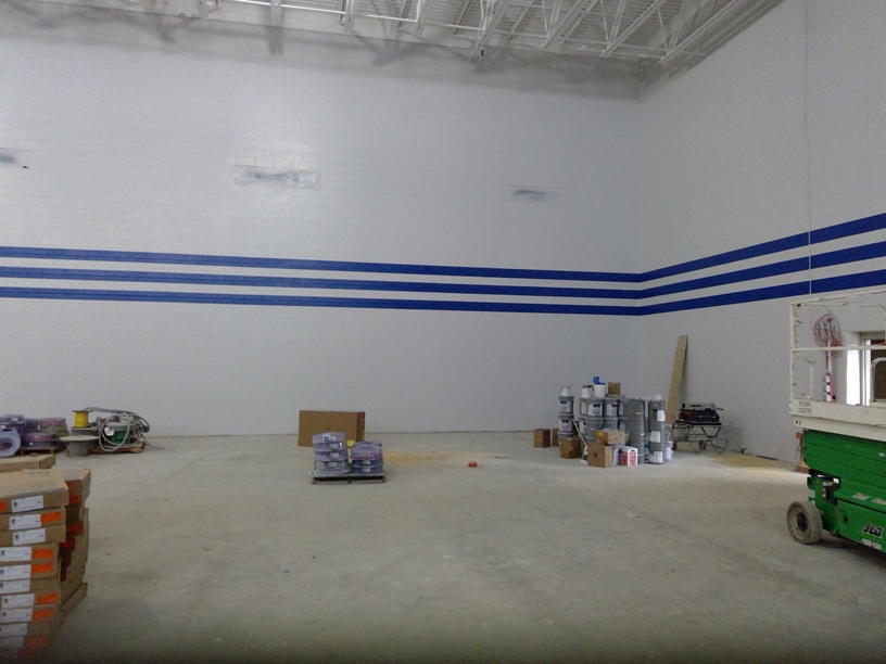 Photo of the Gym walls being painted.