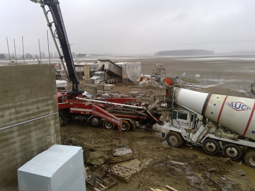 Photo of the Concrete truck feeding the pump.