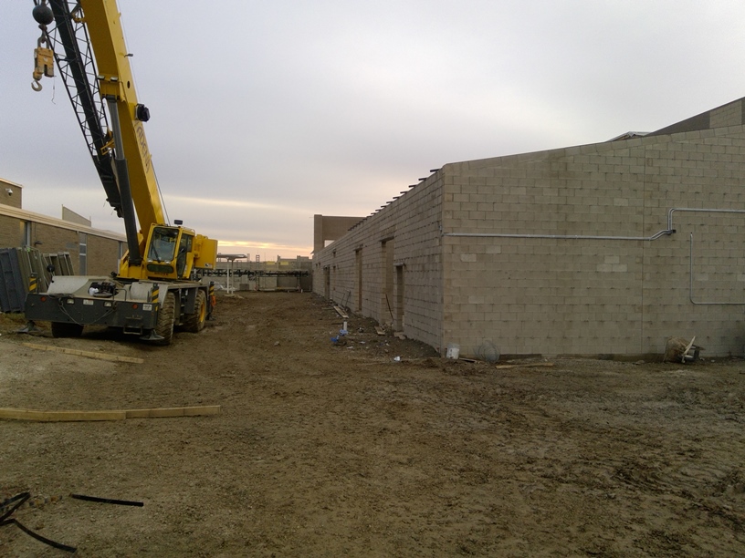 Photo of the Band room and future courtyard between the buildings.