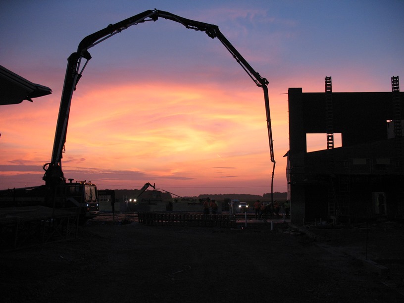 Photo of the Sunrise over the academic wing as the floor was being poured.