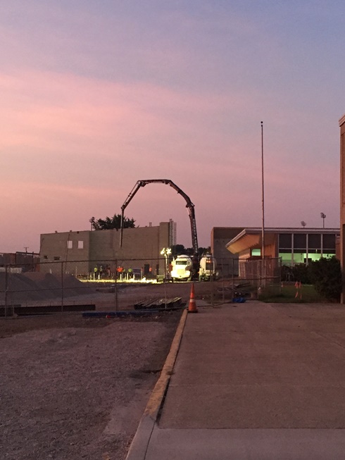 Photo of the Early morning pouring of concrete in the new academic wing.