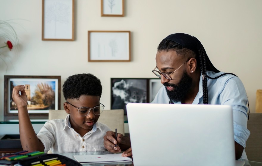 Parent teaching his student
