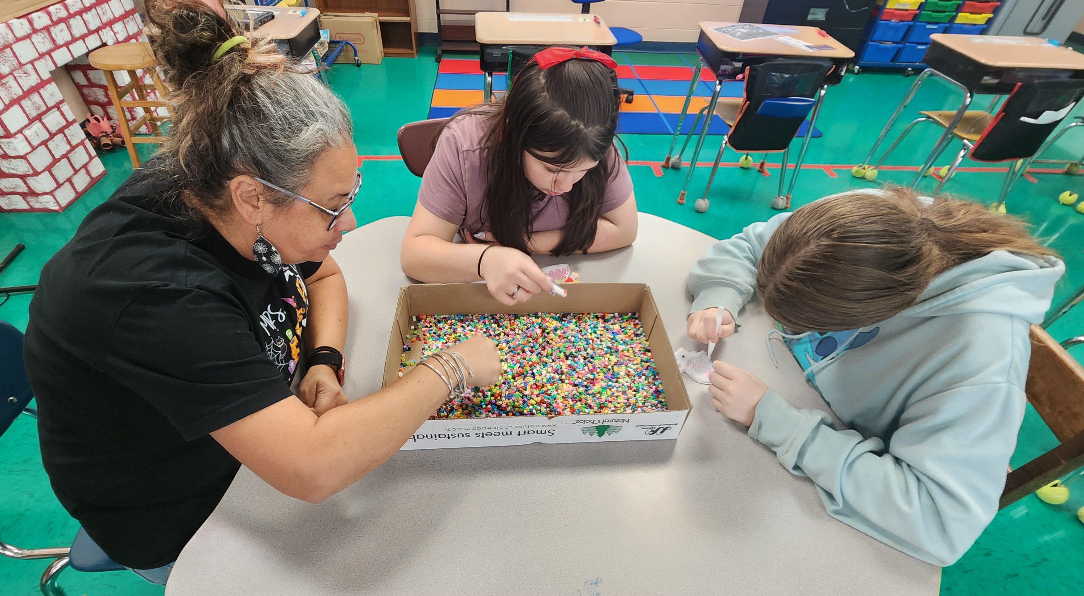 Students sorting beads