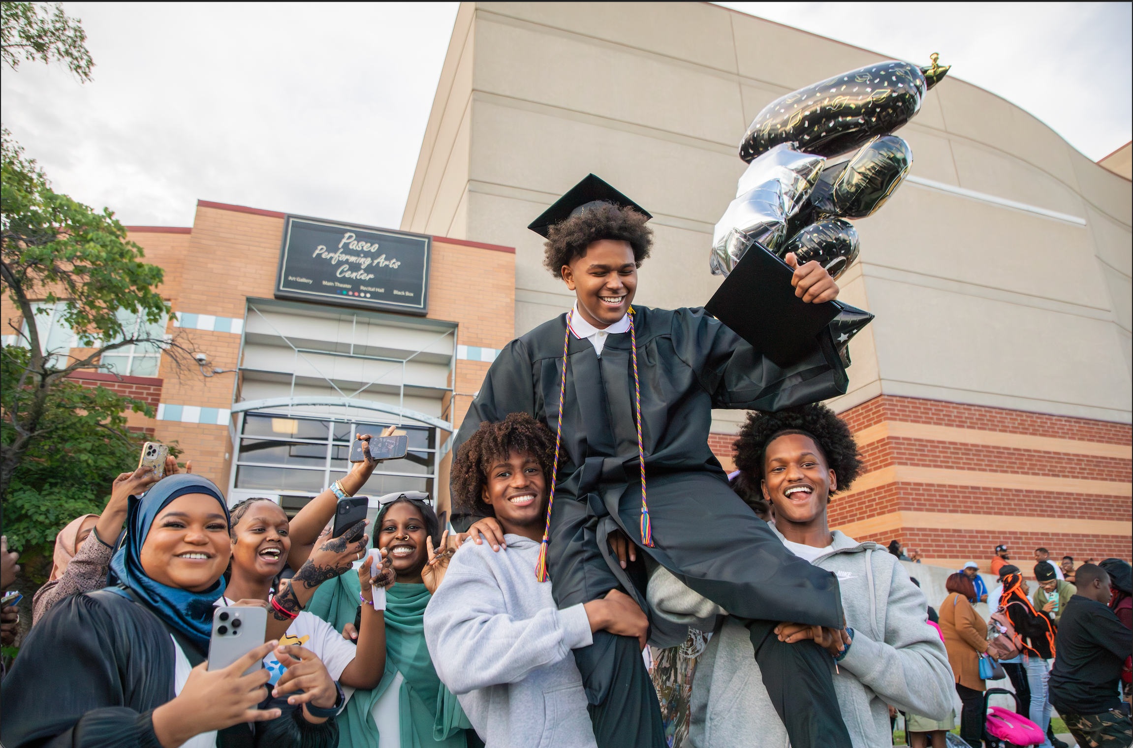 students cheering at graduation
