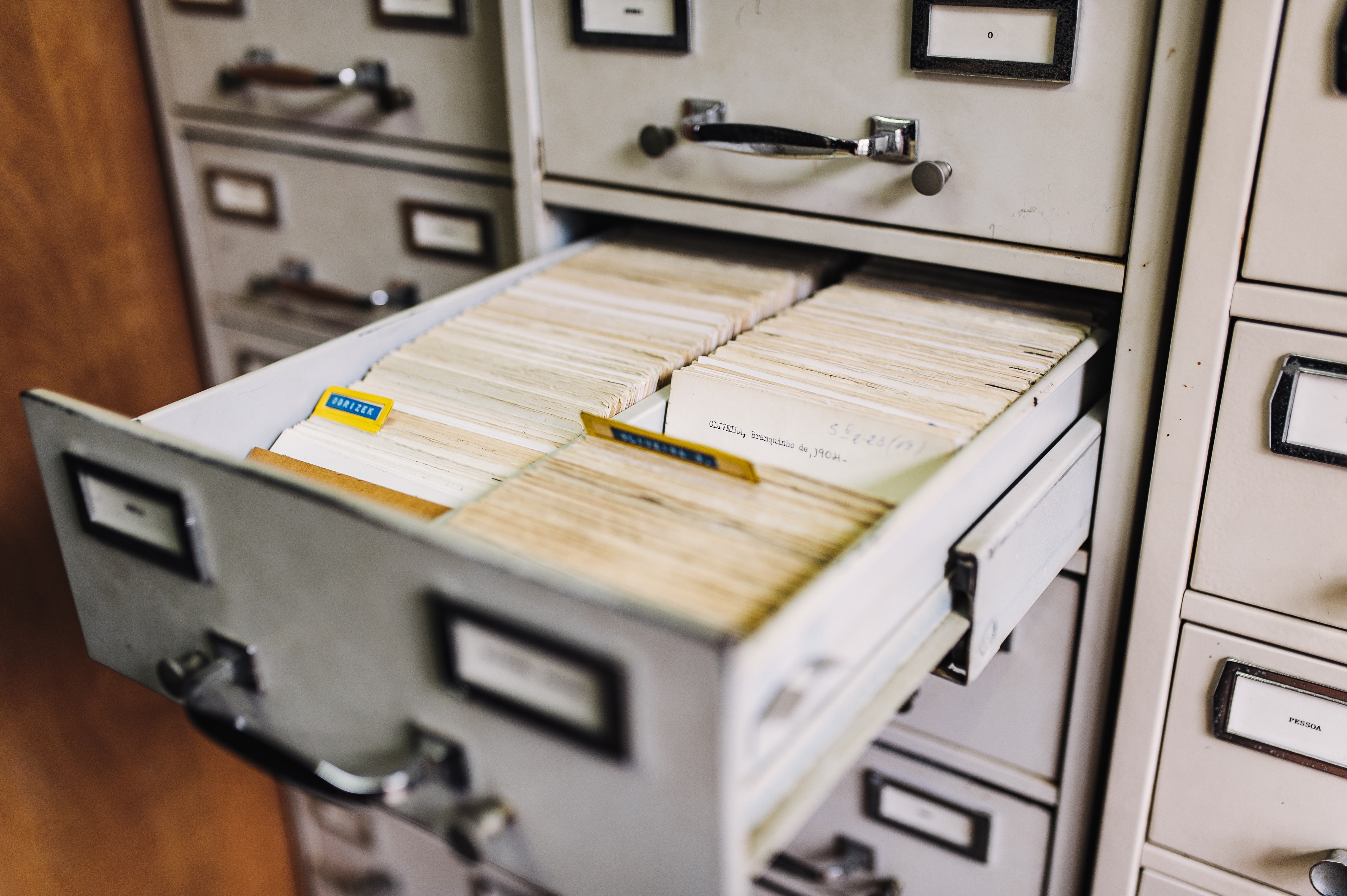 filing cabinet with a drawer open exposing lots of file folders