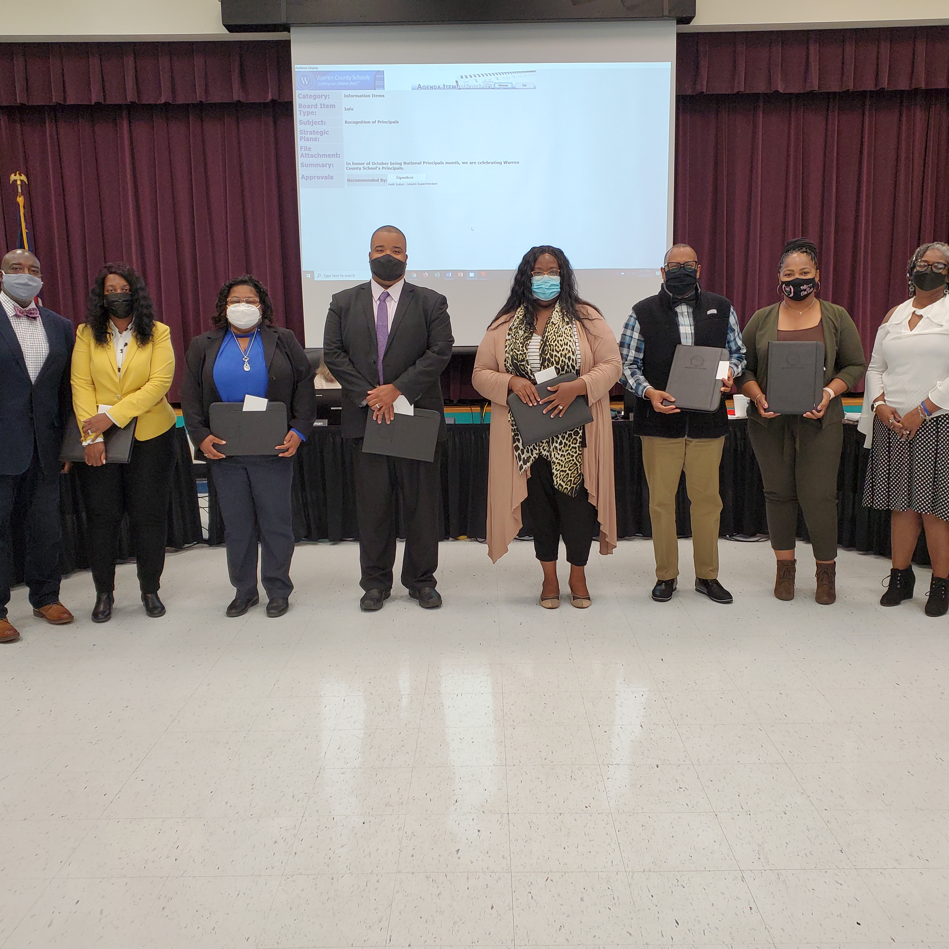 Principals honored at a School Board meeting