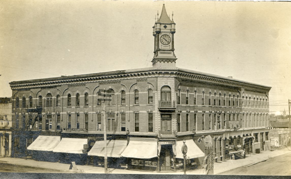  MICHELSON BUILDING  102 West Third Street  The Michelson Block was built in 1885 by James Michelson and expanded to include a third story in 1887.  It was a creation of architect Julius Fuehrmann, who had his office in the building.  In 1909 the north addition was added with Wells Fargo & Co. Express as a tenant.  Other tenants at this time included the Onyx Bar and Michelson’s Jewelry Store on the corner.  The clock came from the Seth Thomas Co. and the cost, including tower and frame for a 500 pound bell, was $2,000 according to Daily Independent news stories.  The clock had three faces, lighted at night by gas.  The bell rang each hour.  It was referred to as the "Town Clock".    Many different barbershops occupied 310 N. Pine over the years.  The Puritan, Smith’s, Curly’s, The Royal, Dodd’s, Mickey’s and finally Brownie’s operated here until the 1980’s when it closed its doors.  Businesses that occupied the upper floors throught history include:  Anheuser-Busch, Deffenbaugh Physicians, Harrison and Prince Law Firm, The Pantorium, and Moore Dentistry.    In the 1920’s Rosalio Briseno started the Busline Shoe Shop at 308 N. Pine.  It was named after the intercity buses that parked along Pine street.