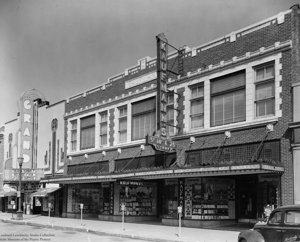  KAUFMANN BUILDING  308 West Third Street  Kaufmann’s Five & Dime Store was a long time business at this address. In 1906, a few years after arriving in Nebraska from Germany, David Kaufmann created central Nebraska’s first five and dime store. In 1924 he opened a new store at this location. It was said that everything from hardware, chinaware, crockery, dry goods, furnishings, stationary, jewelry, and novelties were available at Kaufmann’s. The store also had a popular lunch counter.  The store grew in popularity and eventually there were nine stores affiliated with Kaufmann’s across central Nebraska, including stores in Kearney, North Platte and Cozad. 