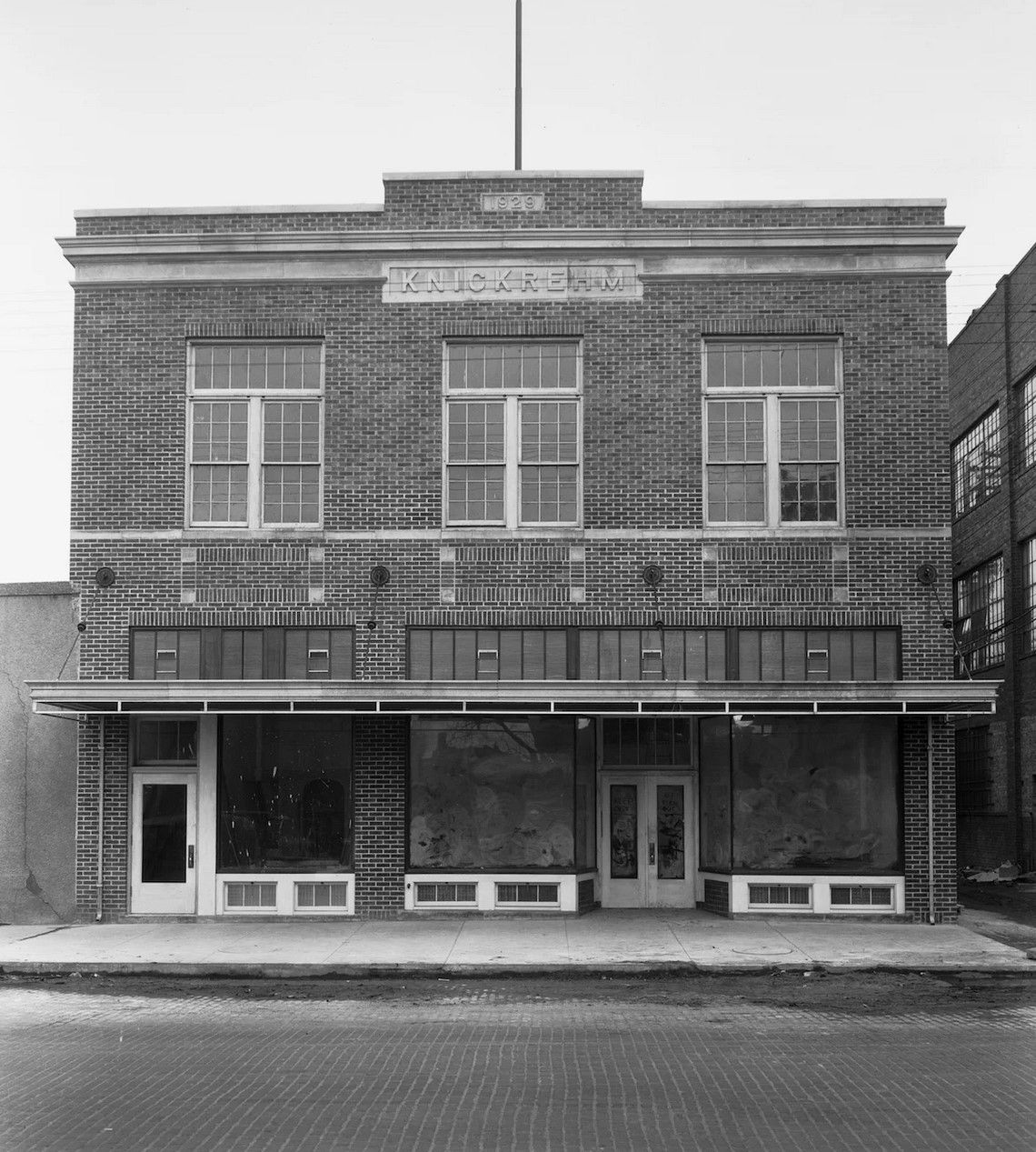 Knickrehm Building  Knickrehm Groceries first opened on Fourth and Pine Streets in 1898 by John Knickrehm.  Two sons, John Jr. and Carl grew up with the business.  In 1912, the two boys were admitted to partnership and the name was changed to Knickrehm & Sons.  In 1916 John Sr. retired and the business continued under the name Knickrehm Bros. until 1922, when John Jr. purchased the interest of his brother Carl and Became the sole owner of the store.  Knickrehm’s New Market was built in 1929 to accommodate the increasing business.  In 1932 the store employed 12 people.  The grocery store lasted until the 1950’s when it became 3rd City Seed & Supply Co. which later became Earl May Seed & Nursery.  The second floor housed the YWCA for about 30 years.  More recently it was the home to Heartland Dance Studio and is now vacant.