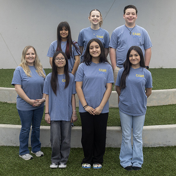 7 Middle School Students pose together.