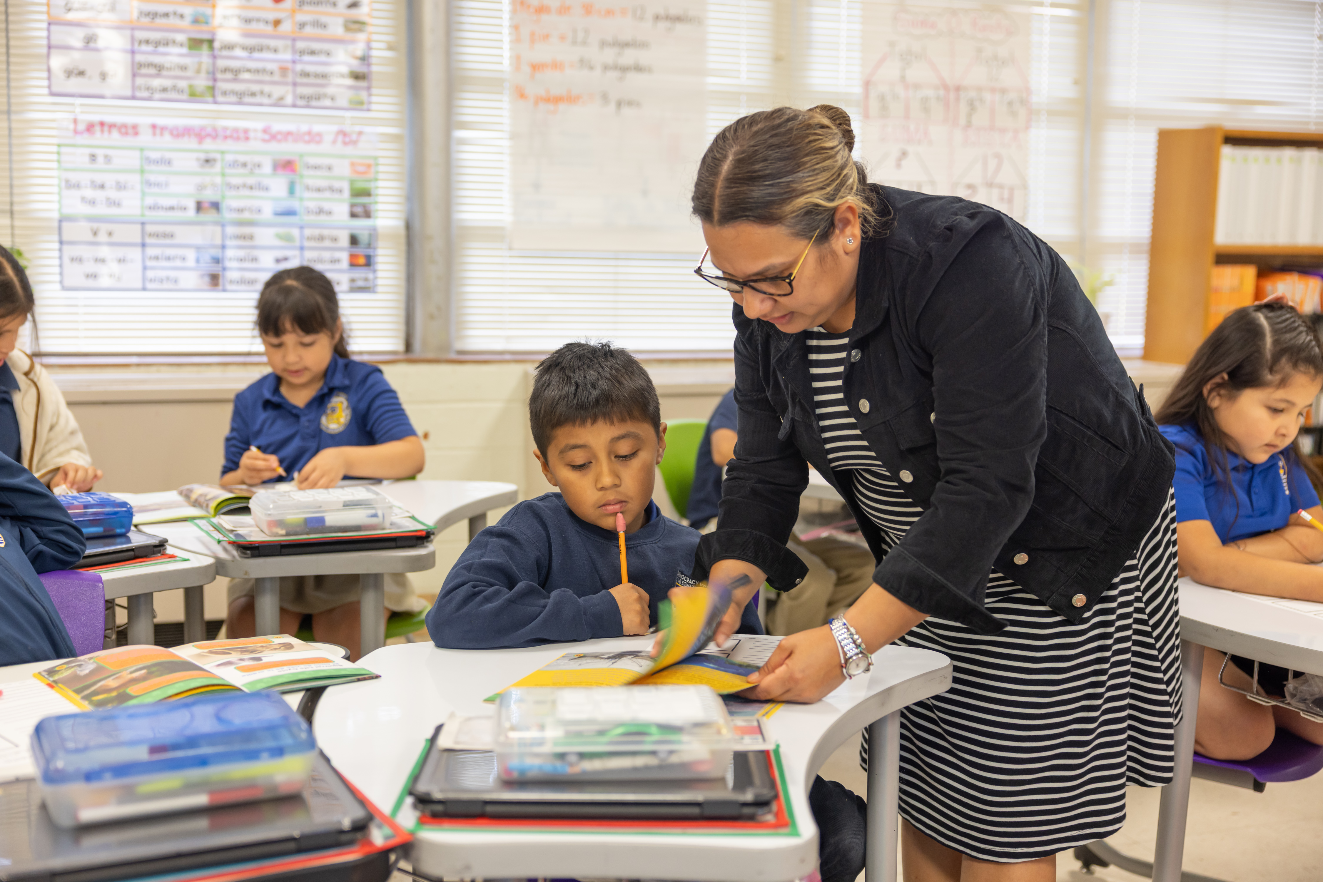 Teacher working with student